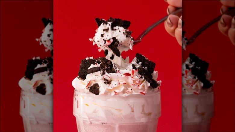 a red robin oreo peppermint crunch milkshake against a red background