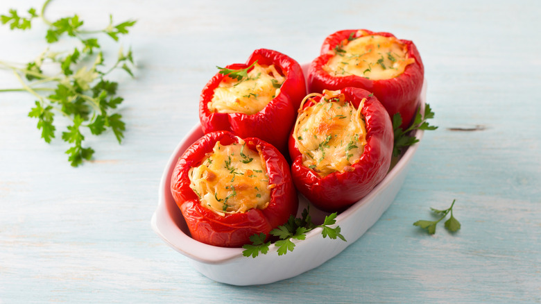Spaghetti-filled bell peppers topped with cheese