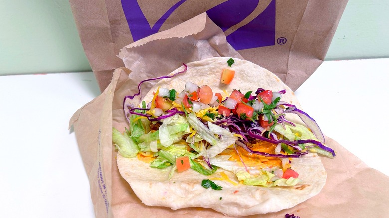 A Crispy Chicken Taco opened up so the insides show