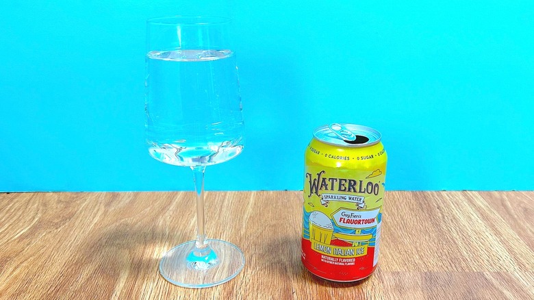 Glass and can of Waterloo Sparkling Water and Guy Fieri's Flavortown Lemon Italian Ice