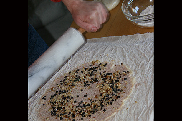 Rolling topping into the dough