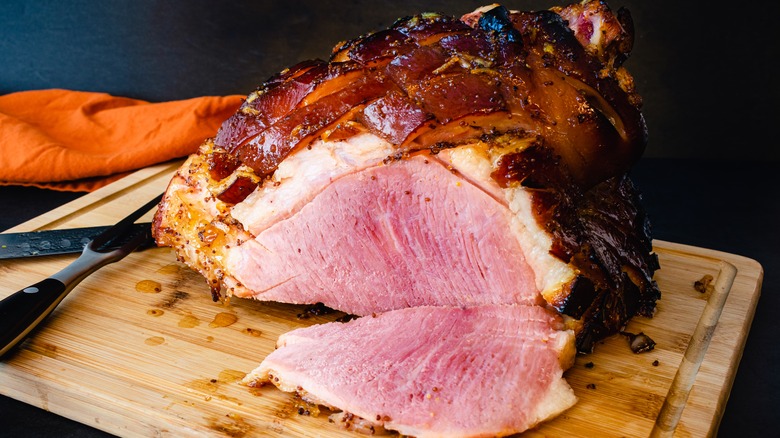 Slice removed from glazed ham