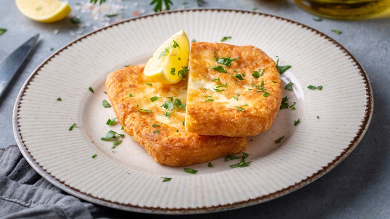 cheese saganaki plated with lemon