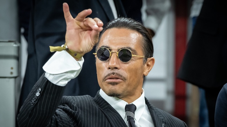 Salt Bae sprinkling motion