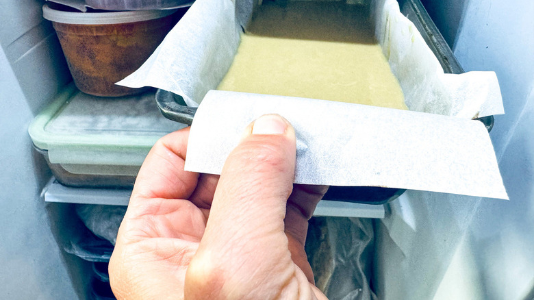 hand inside freezer