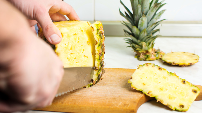 Peeling a pineapple