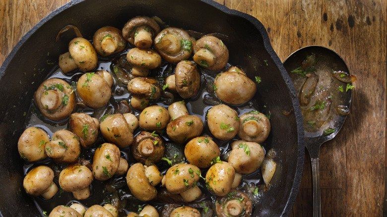 Roasting mushrooms in a pan