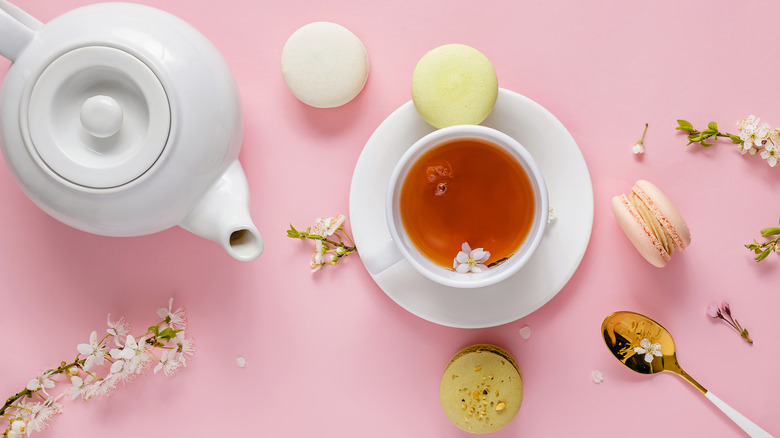 Macarons with tea cup and pot