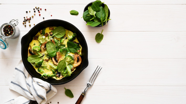 Scrambled egg omelet with mushrooms, spinach, broccoli
