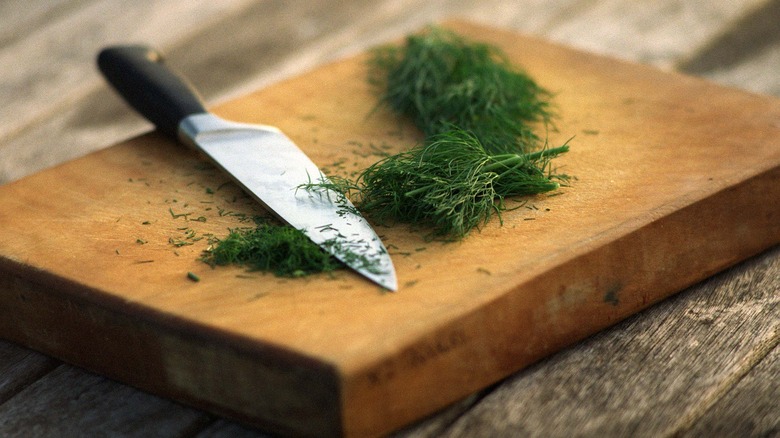 chopped dill on cutting board