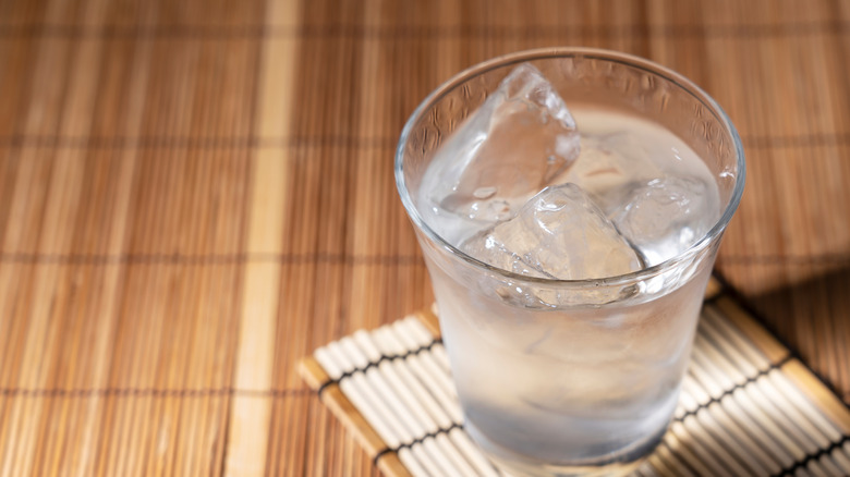 glass of shochu on bamboo