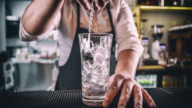 bartender stirring a martini