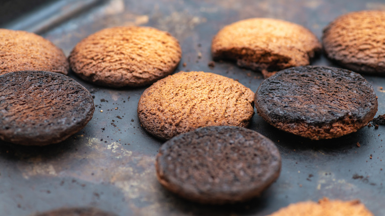 Burnt cookies on a baking sheet