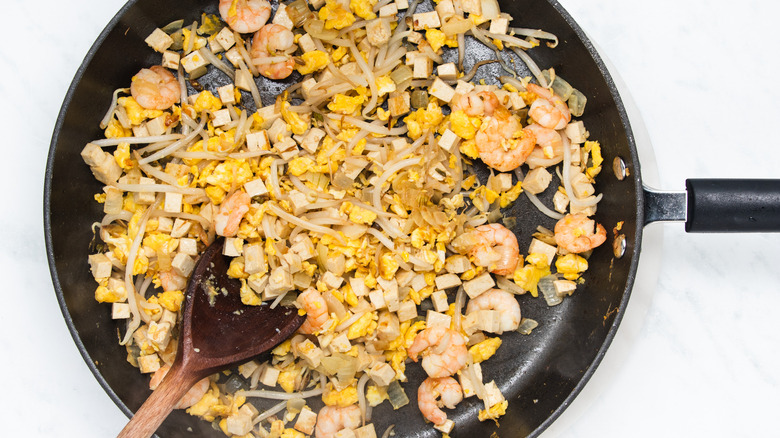 pad thai ingredients in pan 