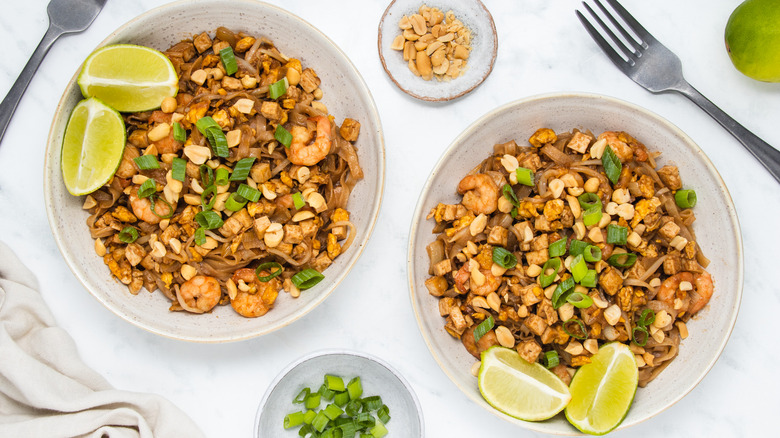 shrimp pad thai in bowls 