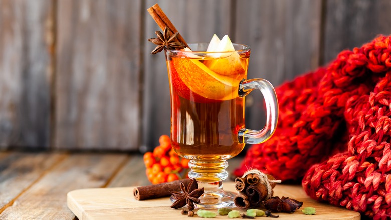 Cocktail with apples, cinnamon, and cloves