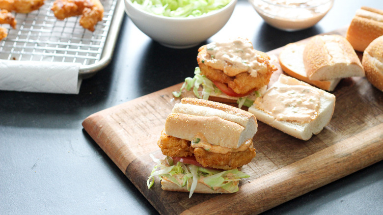 shrimp sandwiches on wooden board
