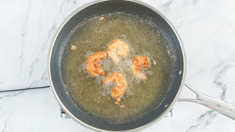 shrimp frying in pan