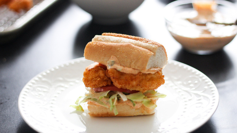 shrimp sandwich on white plate