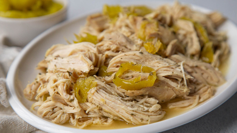 Closeup shredded chicken with pepperoncini