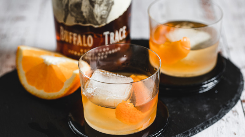 two cocktail glasses on tray