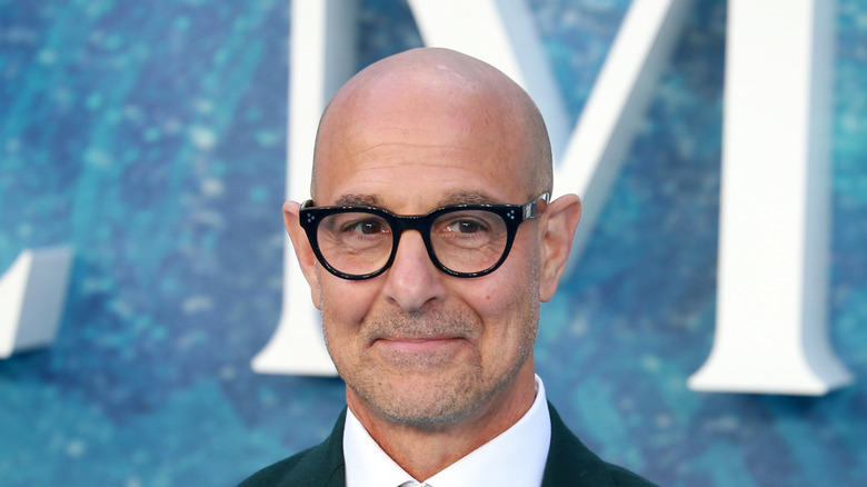 Stanley Tucci wearing black-rimmed glasses