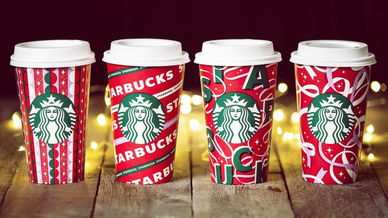 starbucks holiday drinks on a table