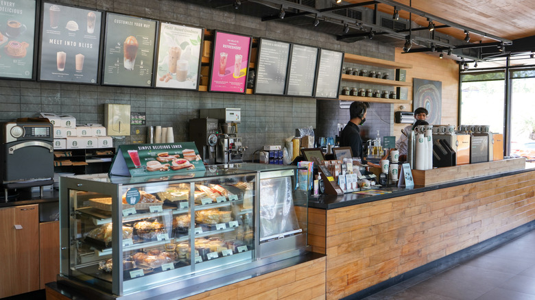 Starbucks counter with menu and pastry case