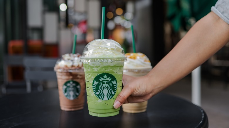 three Starbucks frappuccinos on bar