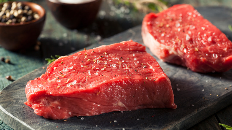 A pile of frozen steaks