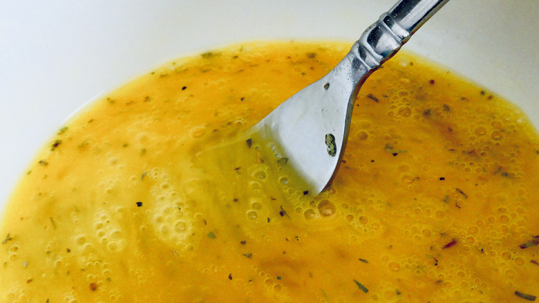 scrambling eggs with a fork