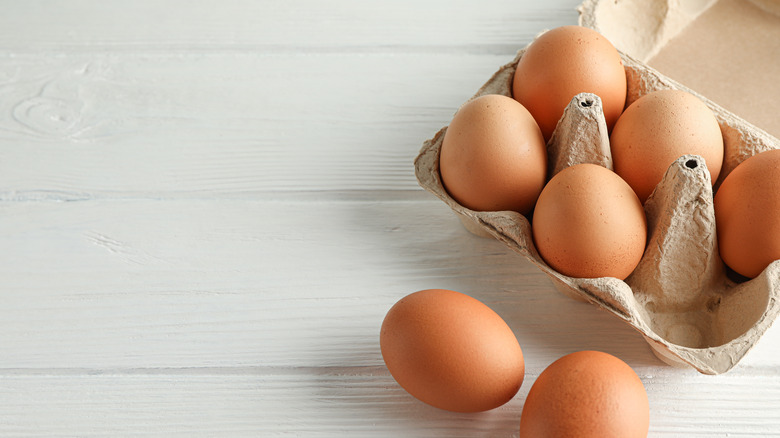 carton of brown eggs