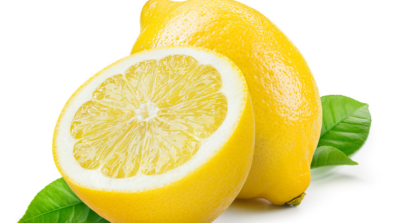 whole and halved lemons