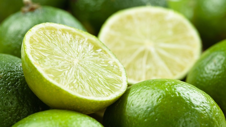 some whole and cut limes
