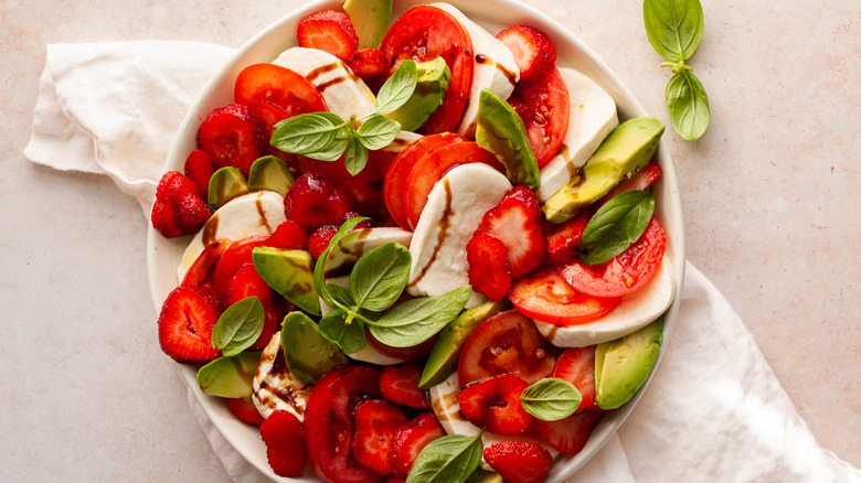 strawberry-avocado caprese salad in bowl 