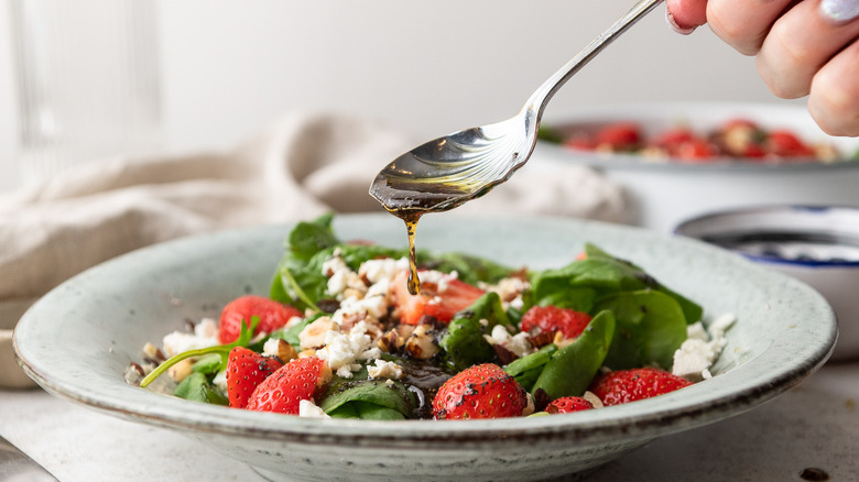 strawberry spinach salad in bowl 
