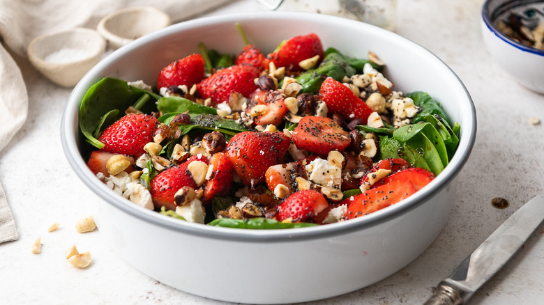 strawberry spinach salad in bowl 