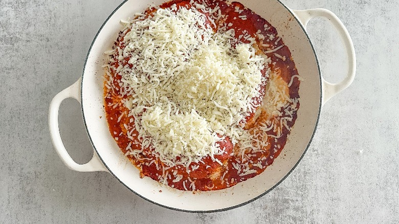red sauce and cheese in skillet