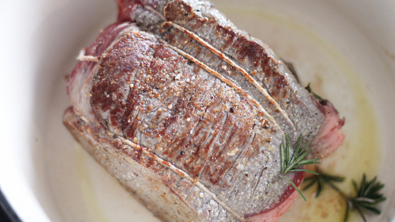 beef searing in pan