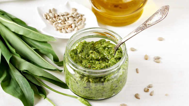 Jar of green pesto made with sunflower seeds