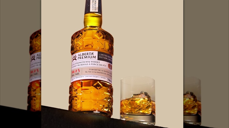 Alberta Premium rye whisky bottle with a glass of whisky