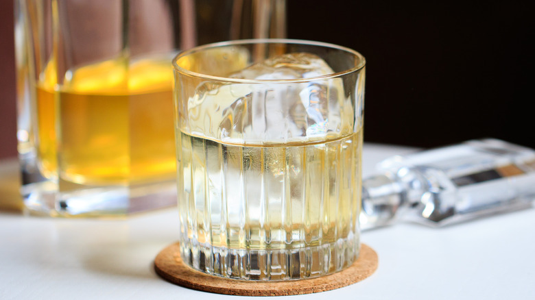 Clarified milk punch in glass tumbler