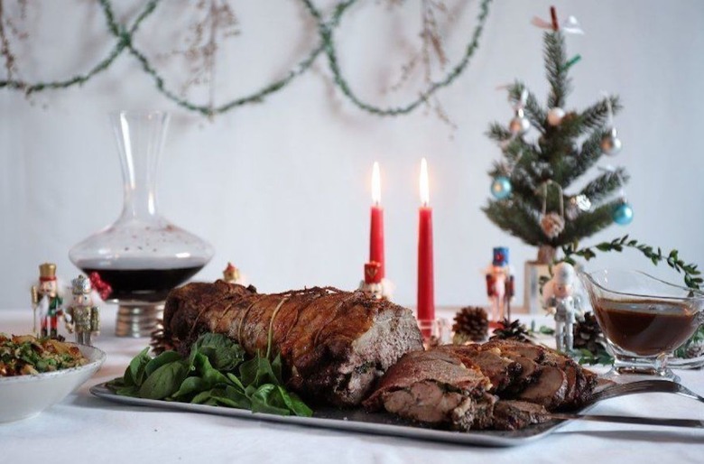 Sweet spiced and stuffed roast leg of lamb with red wine pan gravy
