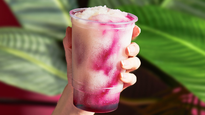 A Taco Bell dragonfruit freeze, with pink-purple swirls in a white slushie