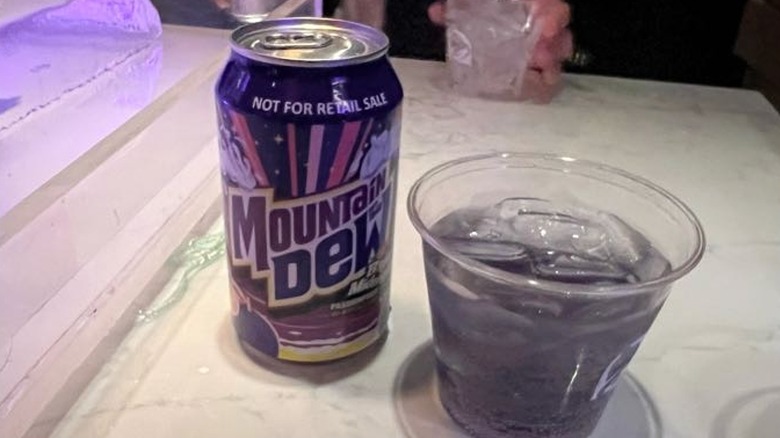Can and clear plastic cup of Baja Blast Midnight