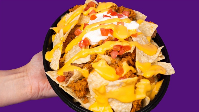 Close up of Taco Bell nachos with nacho cheese