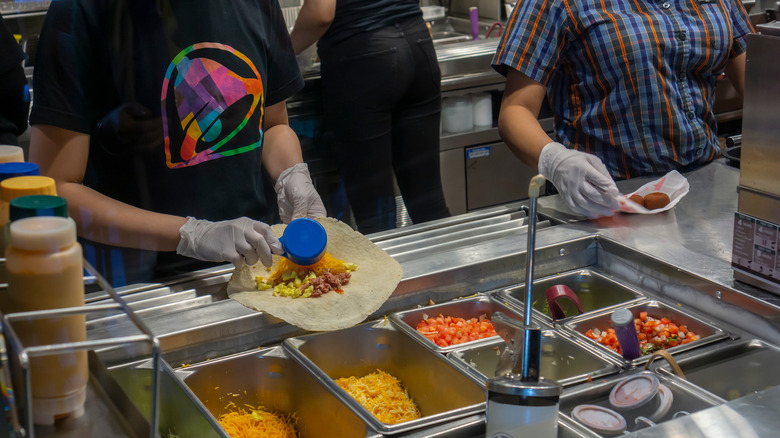 Taco Bell employees making food