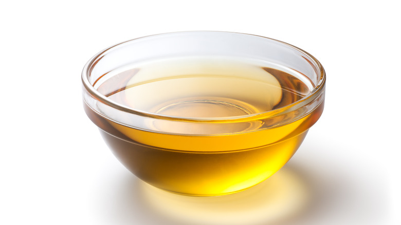 cooking oil in glass bowl