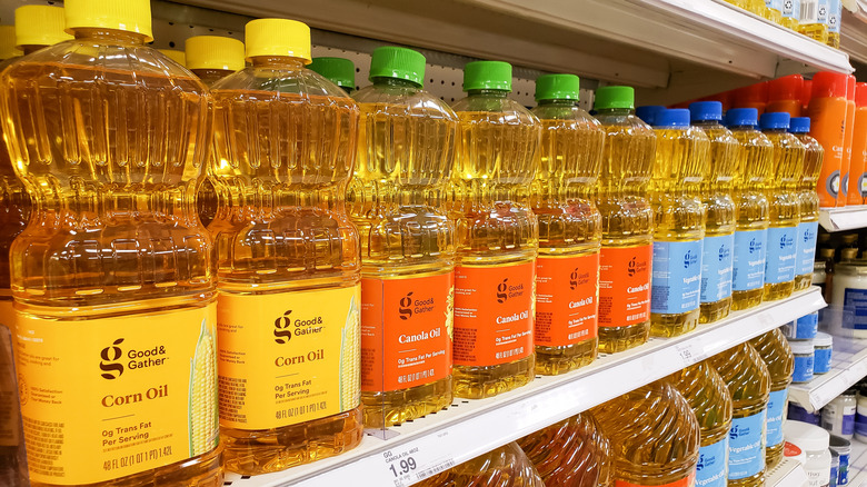 Bottles of Good & Gather cooking oil on store shelf