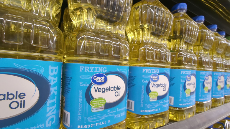 Bottles of Great Value vegetable oil on store shelf